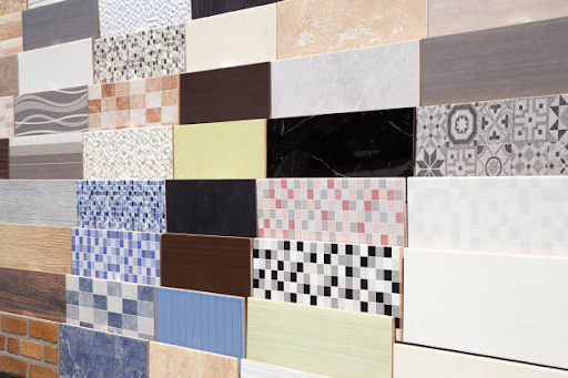 Elegant walk-in bathe clad in massive marble-impact porcelain tiles with contrasting Ceramic Decor tile niche