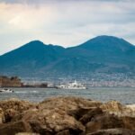 The Shadows of Mount Vesuvius and the Eternal City’s Skyline: Visual Echoes of the Tyrrhenian Coast