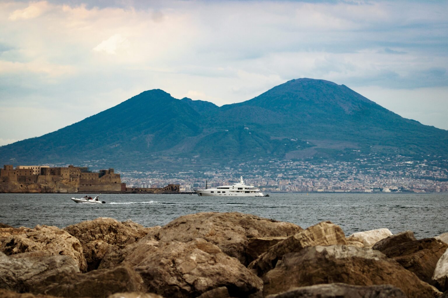 The Shadows of Mount Vesuvius and the Eternal City’s Skyline: Visual Echoes of the Tyrrhenian Coast