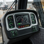 Heavy equipment cabin with integrated instrument cluster dashboard
